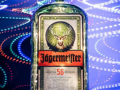 Water bottle on a black surface with neon lighting